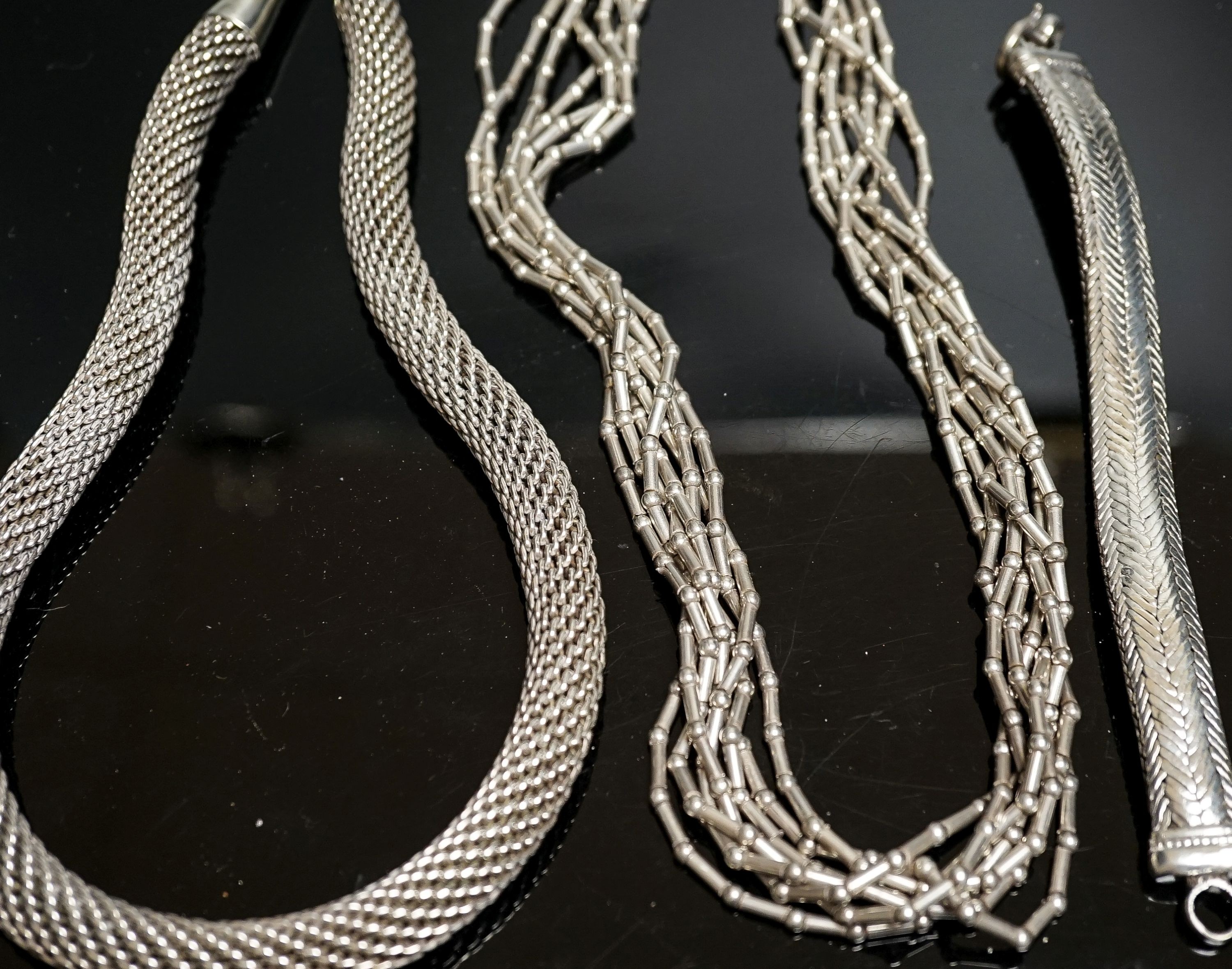 A 925 torque necklace, 46cm, a 925 multi strand necklace and a bracelet